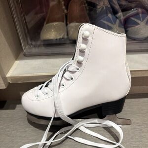 White figure skates with black accents, white laces. Size 12y